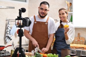 Couple cooking together in the kitchen for influencer marketing campaign.