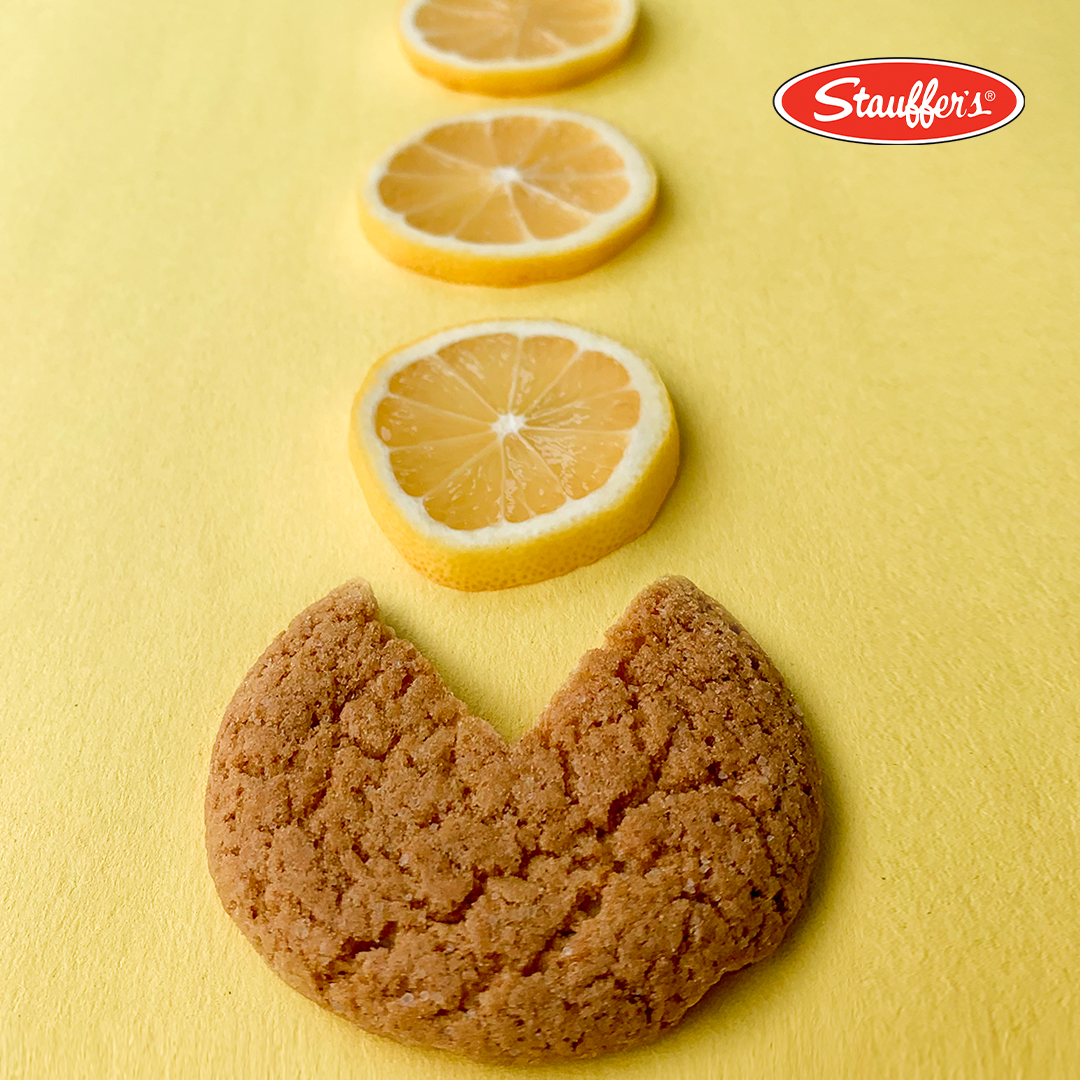 A creative social media marketing visual featuring Stauffer’s Lemon Snap Cookies and fresh lemon slices, designed for engagement. A fun, Pac-Man-inspired layout highlights the power of visual storytelling used by social media agencies.