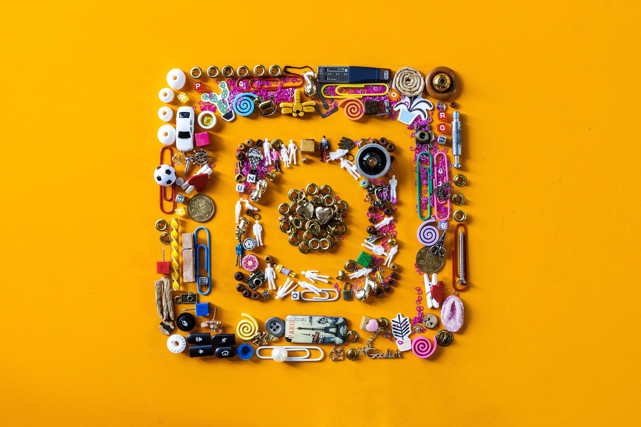 Instagram logo collage made from small objects on an orange background — hero image for Instagram Statistics 2025