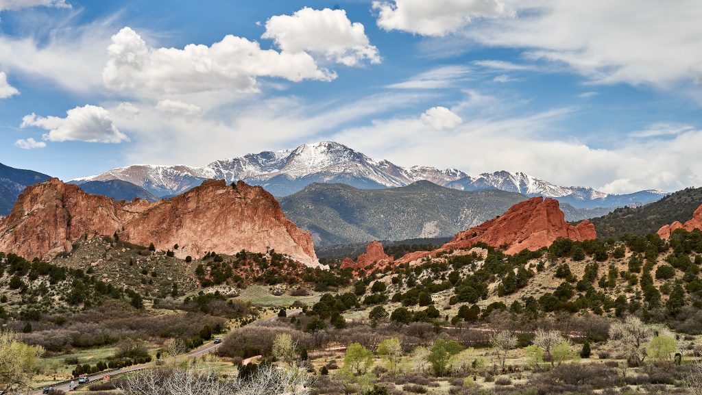View of Garden of the Gods with red rock formations and mountains in Colorado, representing digital marketing agencies supporting brands across the state.